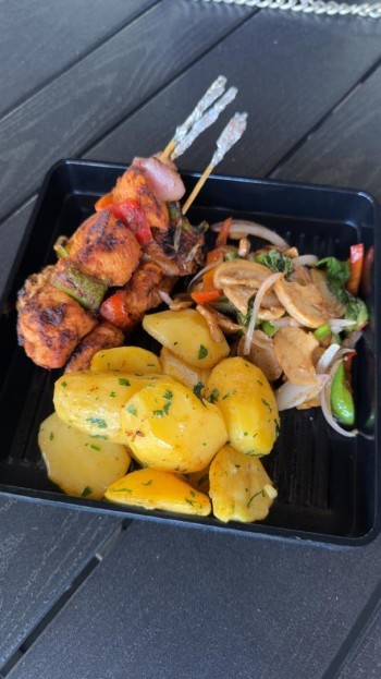 Chicken Kebab with buttered potatoes with mushroom sauce sides